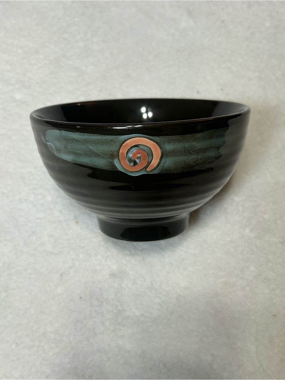 Unique Artistic Black Ceramic Bowl with Teal Accent and Spiral Detail